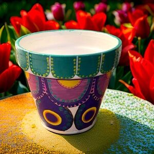 Hand crafted upcycle Terra cotta pot painted white green yellow purple geometric